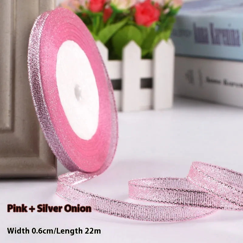 Roll of 0.6cm wide polyester gift ribbon in various colours including gold leaf, coffee and sky blue options