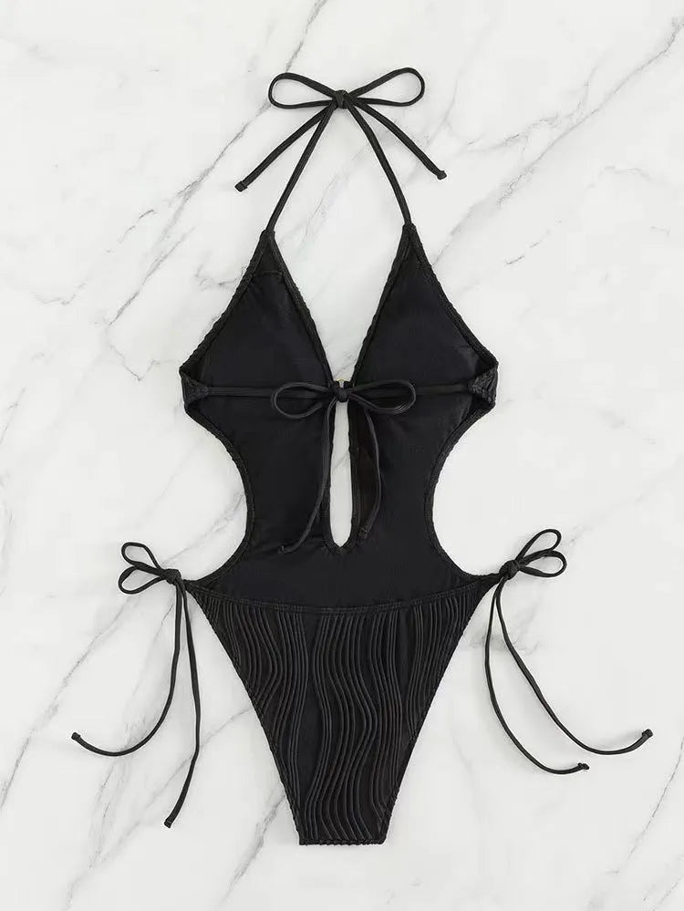 Women's black lace-up triangle bikini swimsuit on a mannequin