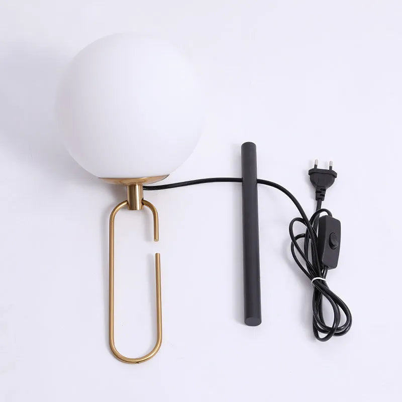 Modern Nordic glass wall lamp with three light colour options on a contemporary wall