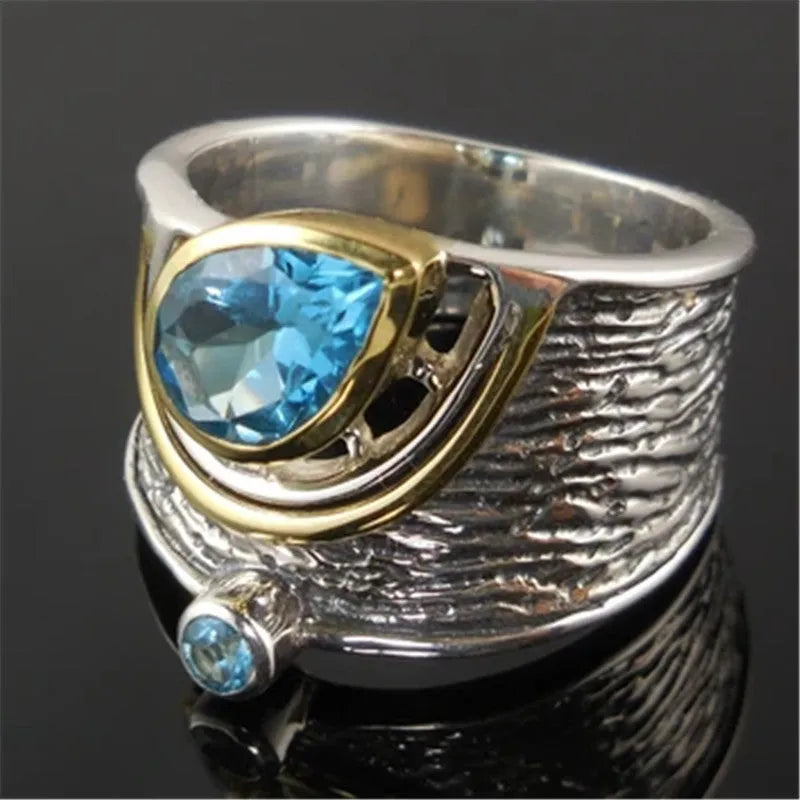 Blue zircon Chinese style women's ring with drop shape and rhinestone detailing on alloy band