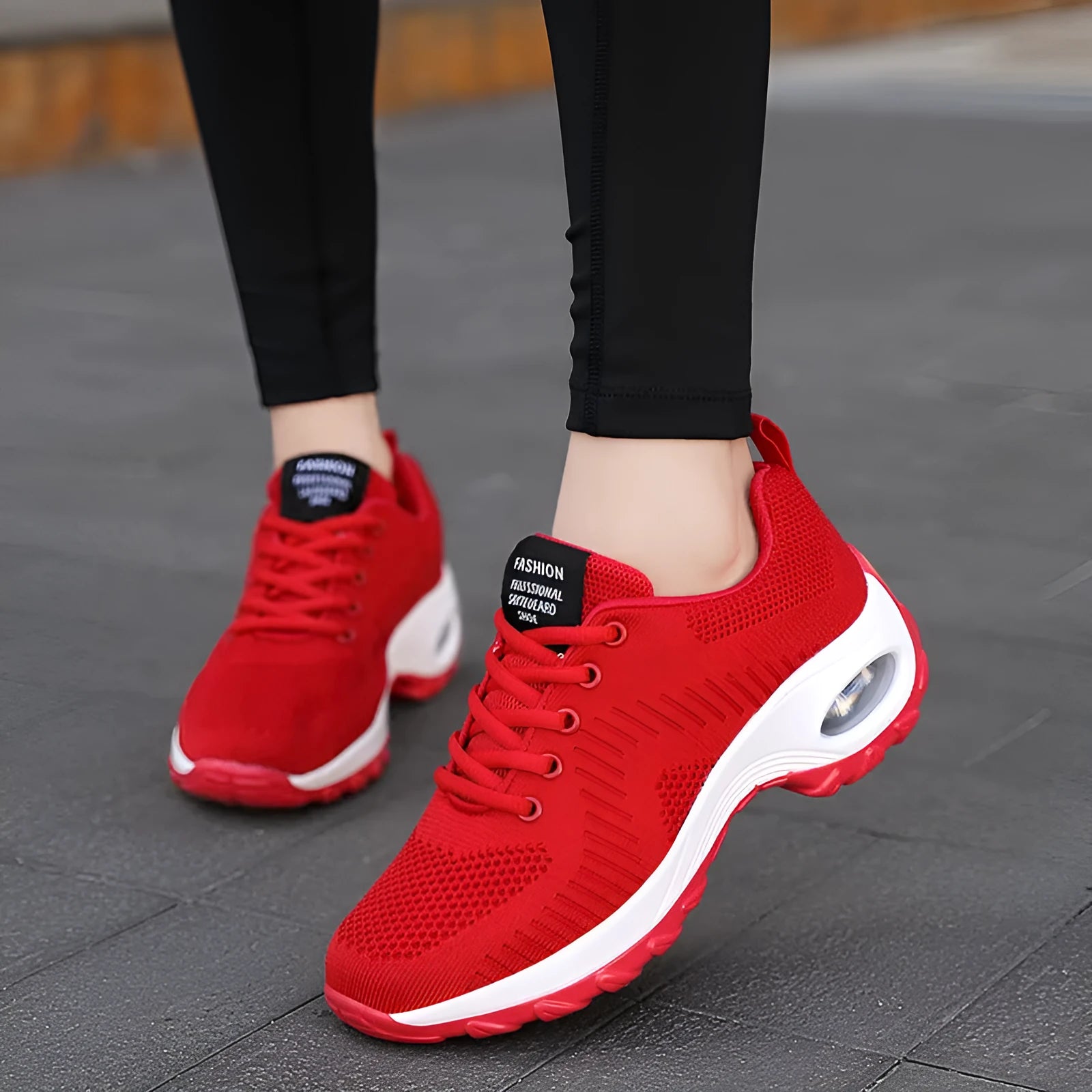Women's red and black mesh sneakers with round toe and front lace-up design