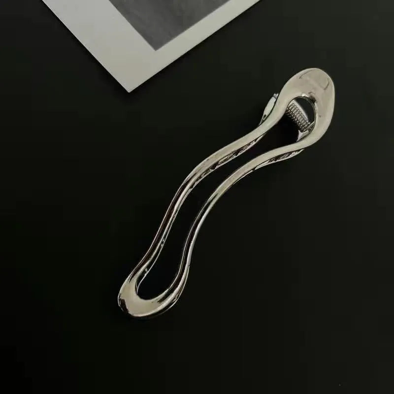 Gold and silver zinc alloy barrettes in square, arc, and triangle shapes for women
