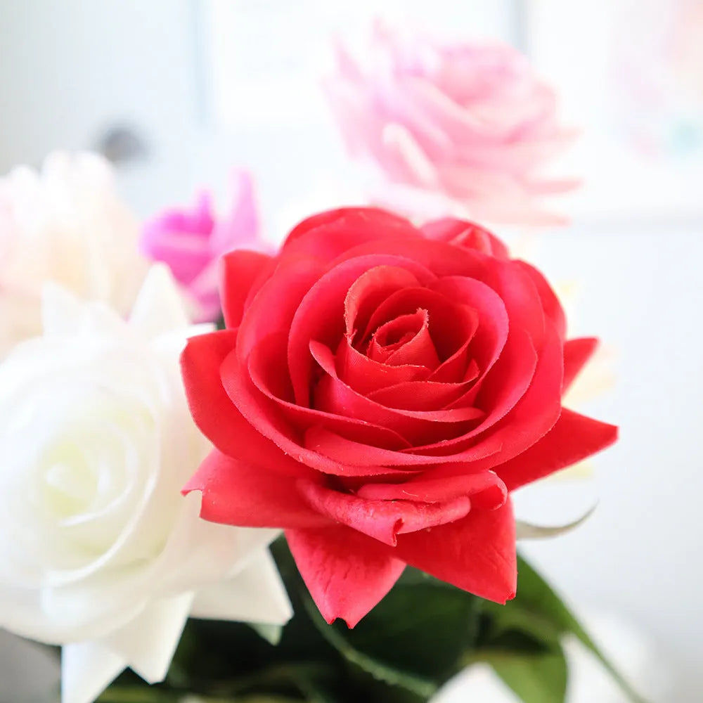 Silk fabric artificial rose bouquet in assorted colours with realistic petals, approximately 42cm long