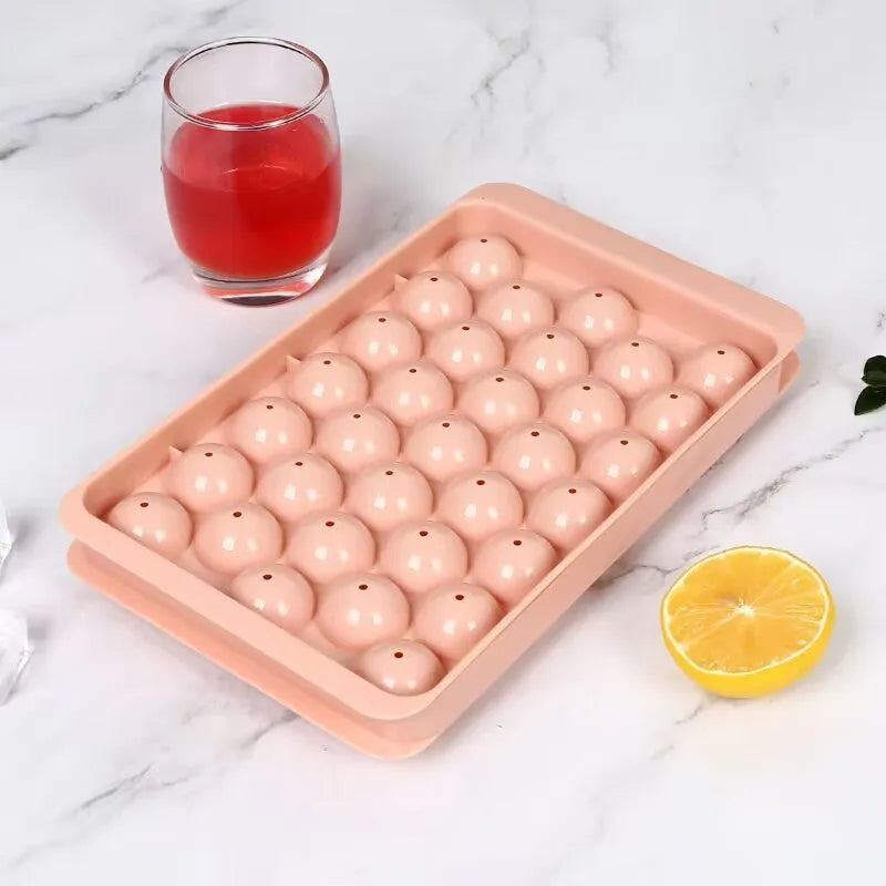 Large blue silicone ice cube tray with 33 round grids and a clear lid
