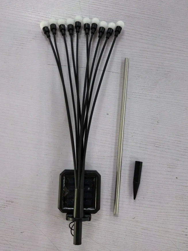 Solar-powered LED garden ground light with multiple light heads and a stainless steel spike for installation.