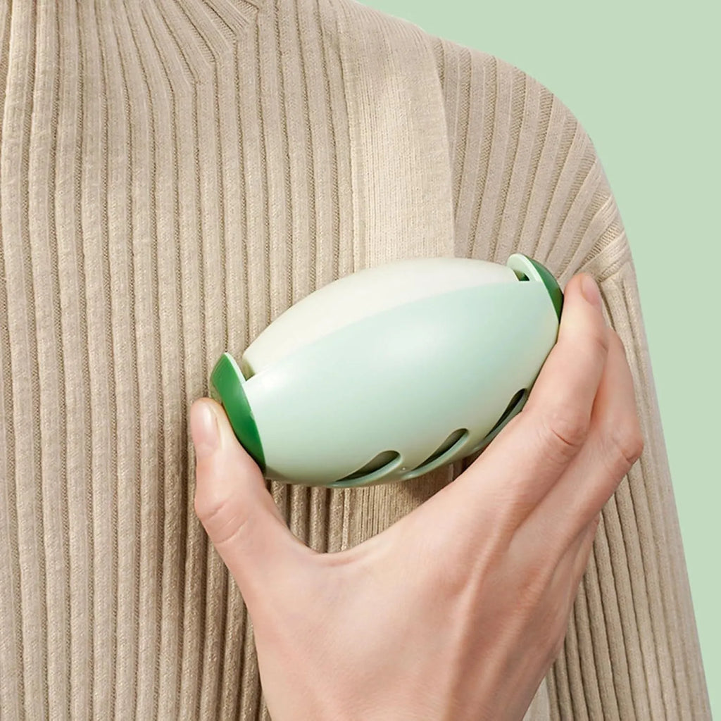 Green and white reusable gel lint roller balls for pet hair removal on fabrics