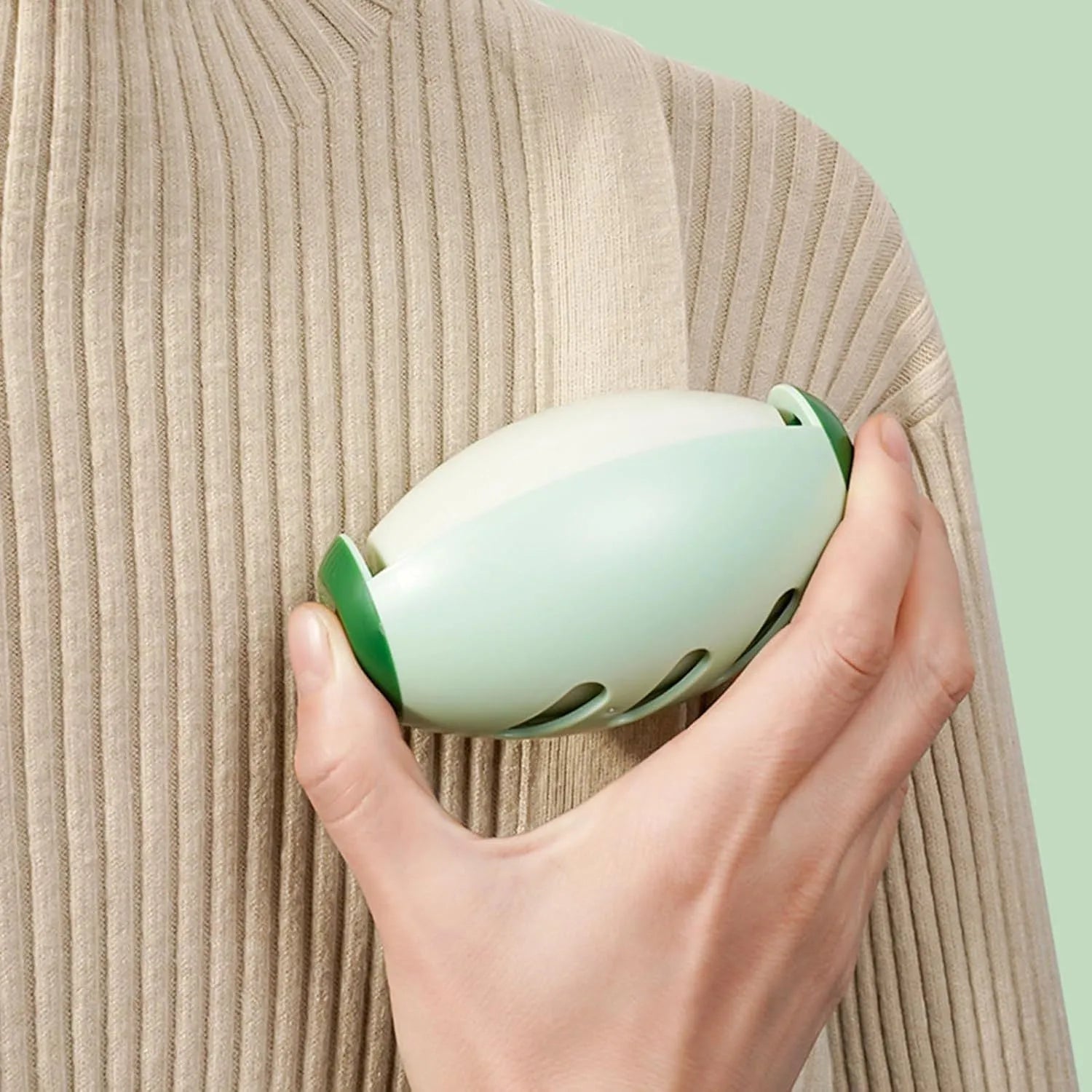Green and white reusable gel lint roller balls for pet hair removal on fabrics