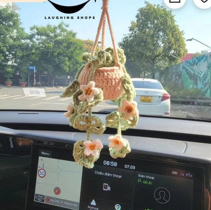 Green and white knitted rope car plant ornament with 8cm base and hanging rope.