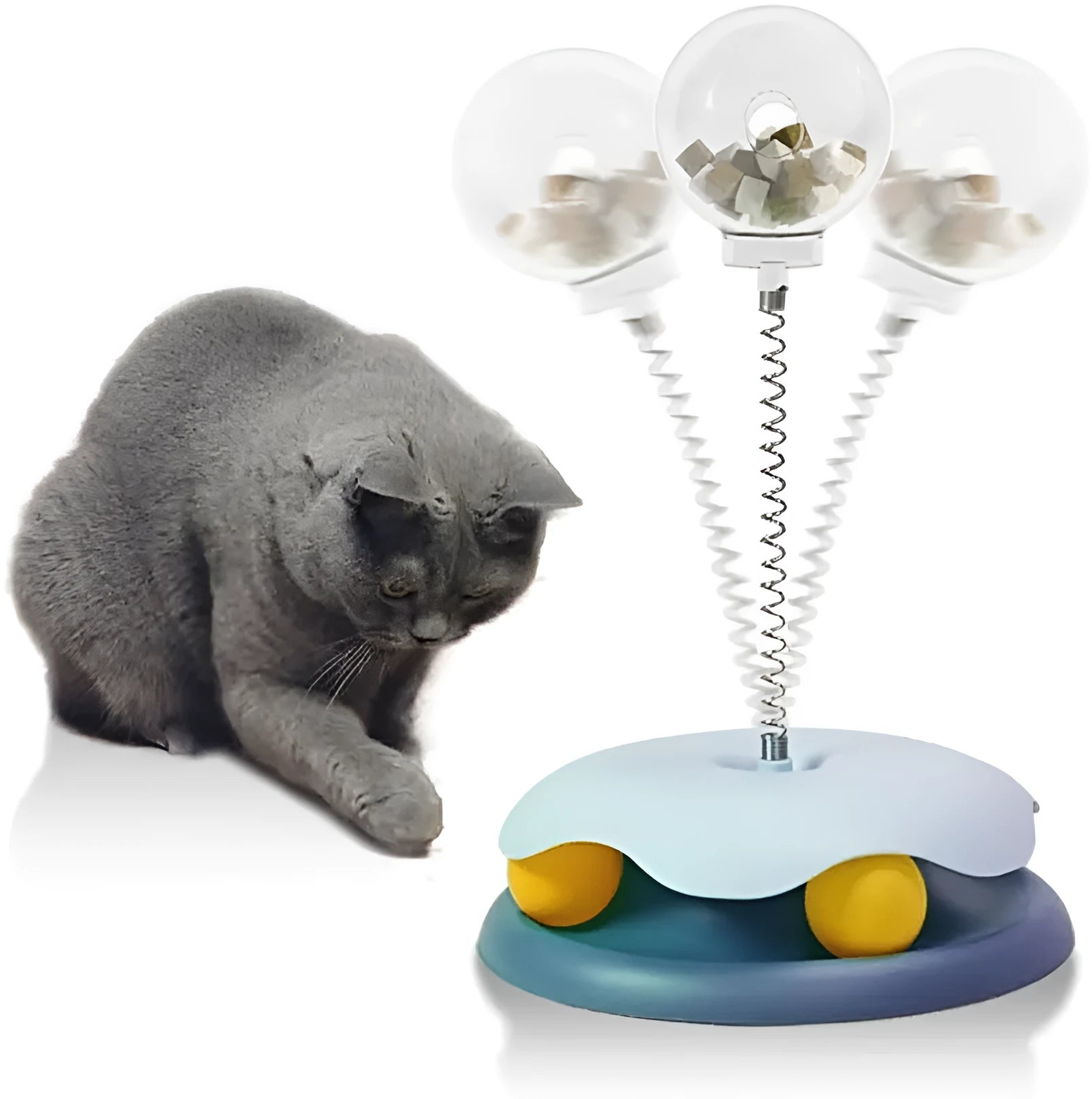 Blue or green PP plastic cat treat dispenser toy with a built-in track ball on a flat surface.