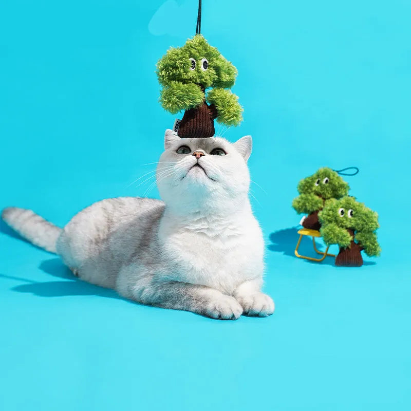 Pine tree shaped cat toy with bag pendant, showing small, medium, and large size options