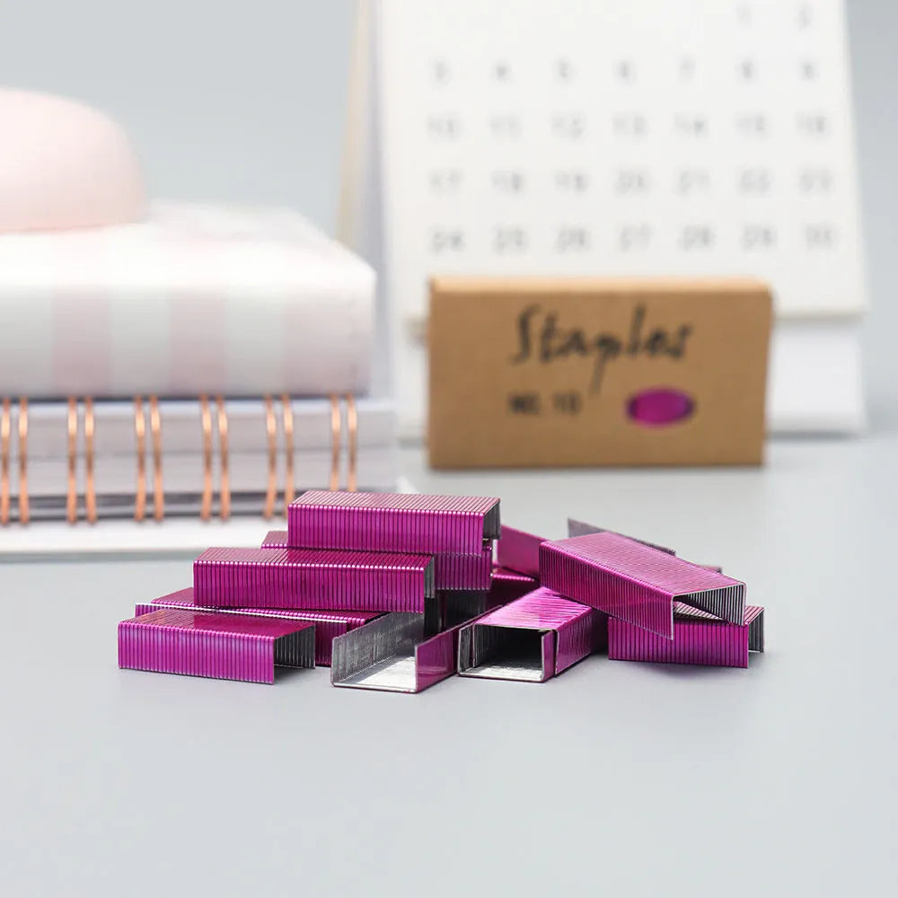 Box of 1000 metal staples for stapler refill in rose gold, black, purple, and rose red colour options.