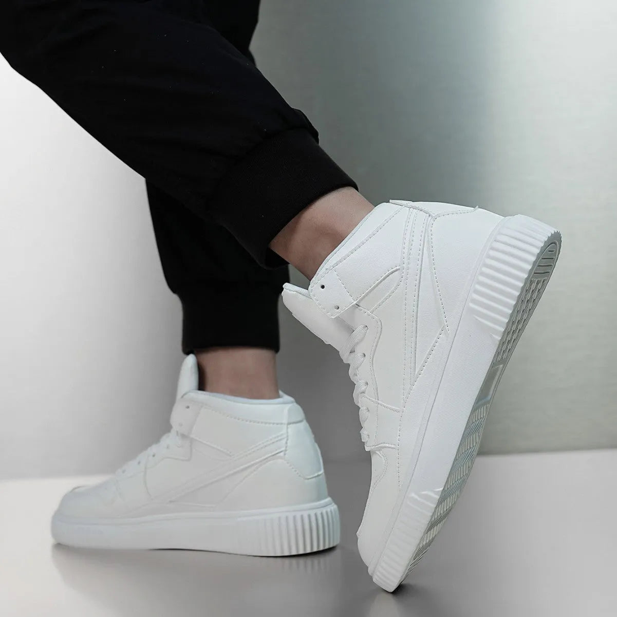 Men's solid white slip-on casual loafers with a rounded toe and microfiber upper.