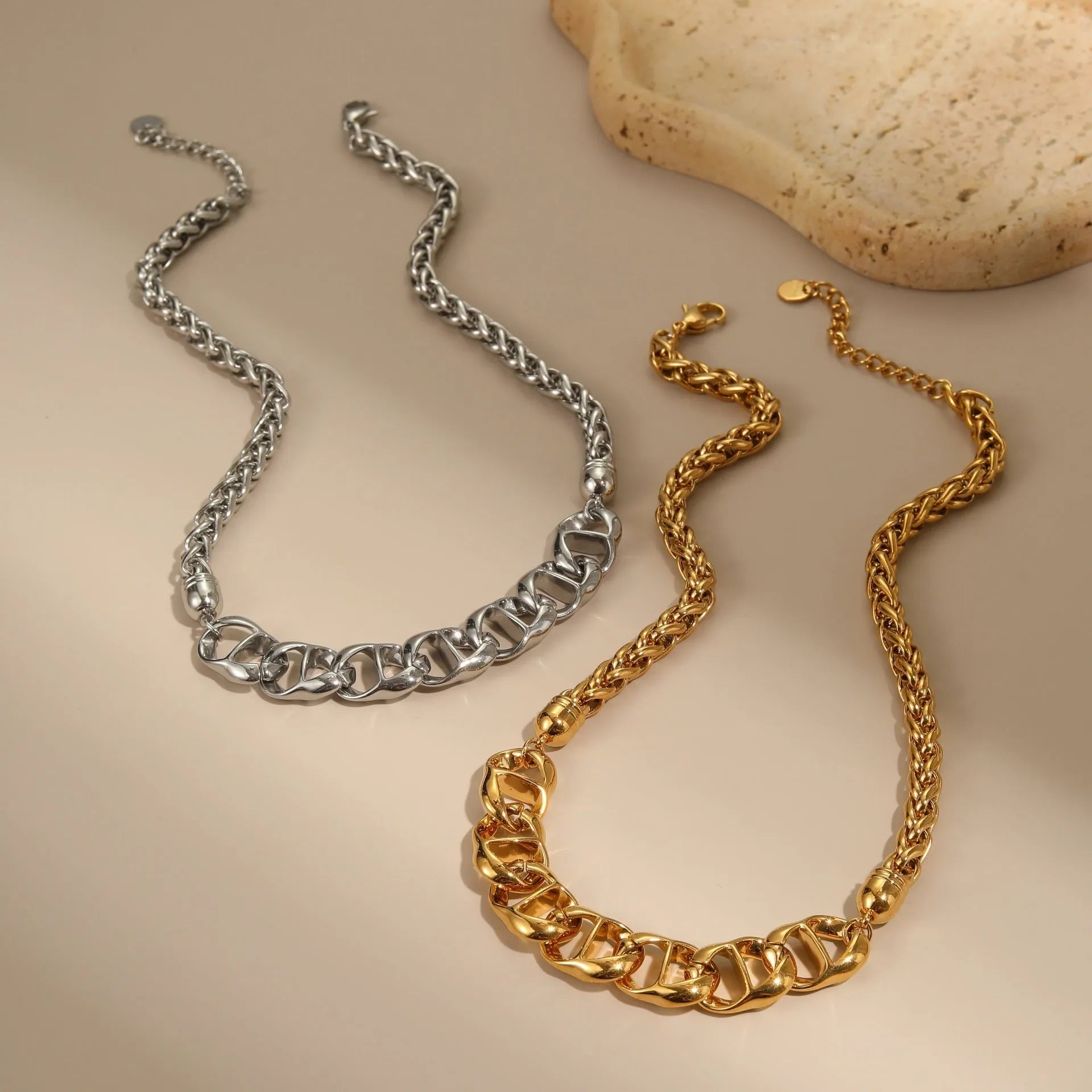 Stainless steel geometric pendant necklace with gold electroplating and chain design details