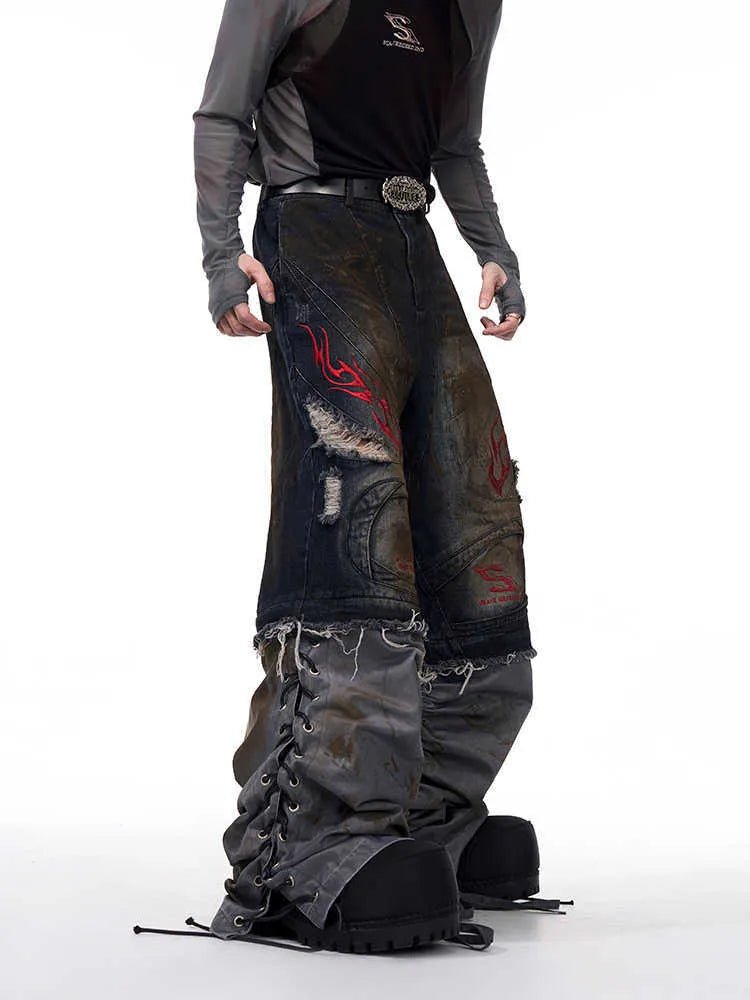 Men's retro denim jeans with detachable trouser legs in a wide leg, loose fit style.