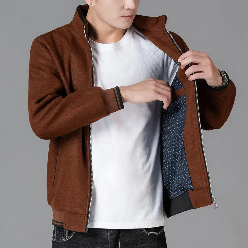 Men's grey sports-style fleece jacket with long sleeves and side pockets on a hanger.