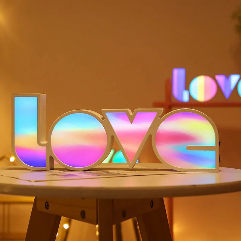 Colourful LED love light decorative lamp with plastic shell on a table