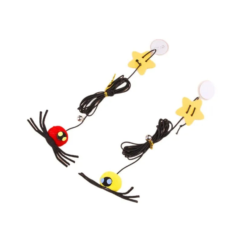 Red and yellow cat hanging door toy with elastic rope, feather, bell, and spider decoration.