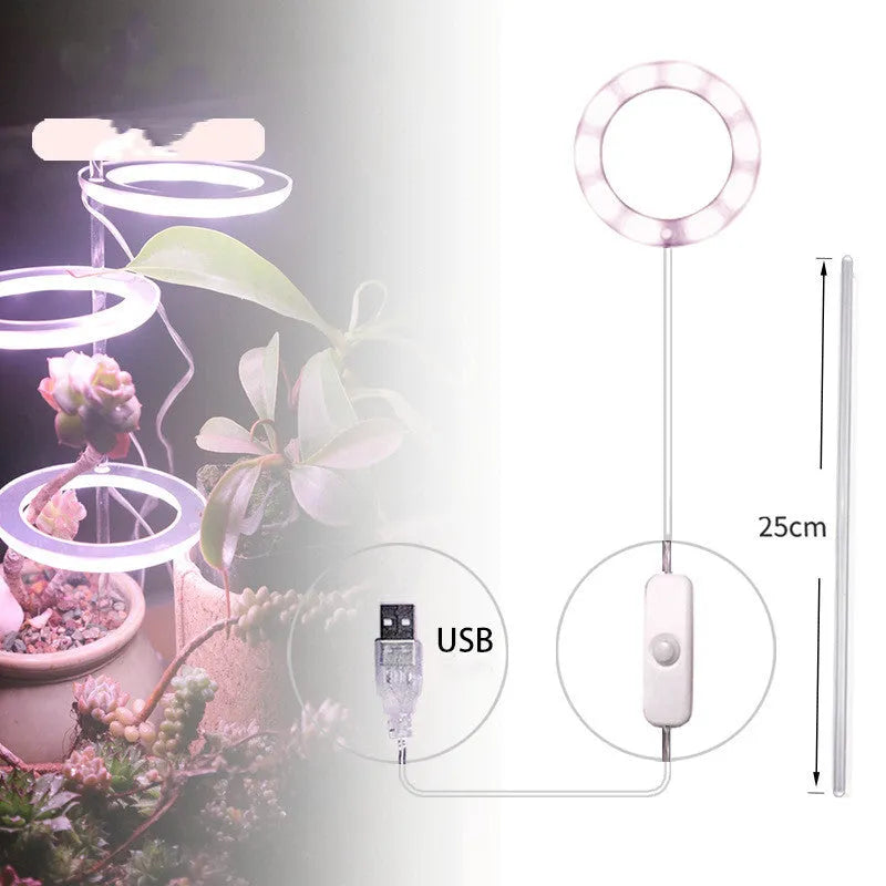 USB LED full spectrum plant grow light with acrylic stick on a table.