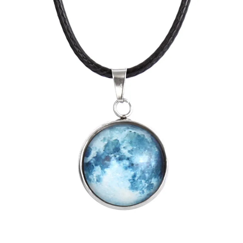 Luminous constellation pendant necklace with adjustable chain on a plain background.