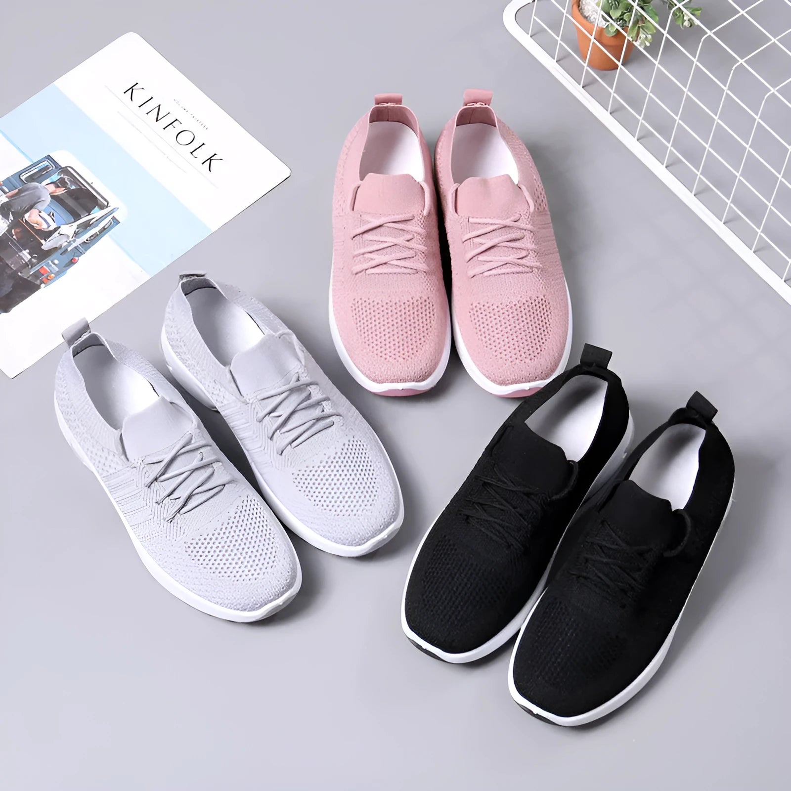 Women's black mesh sneaker with lace-up front and round toe on a non-slip PVC sole.
