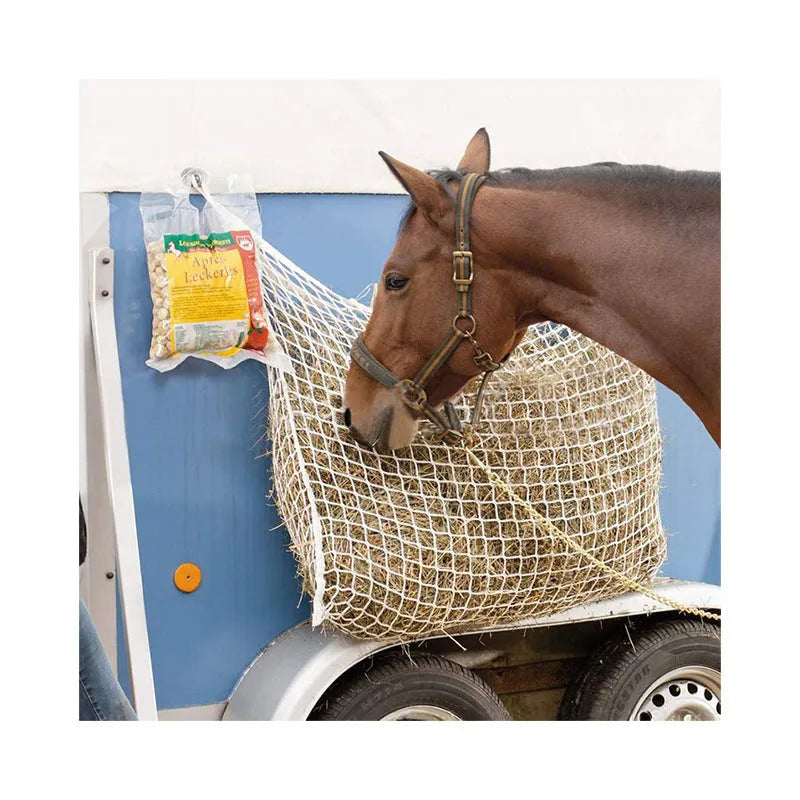 Black woven PE rope hanging feeding bag for horses, shown with hay, next to a white version.