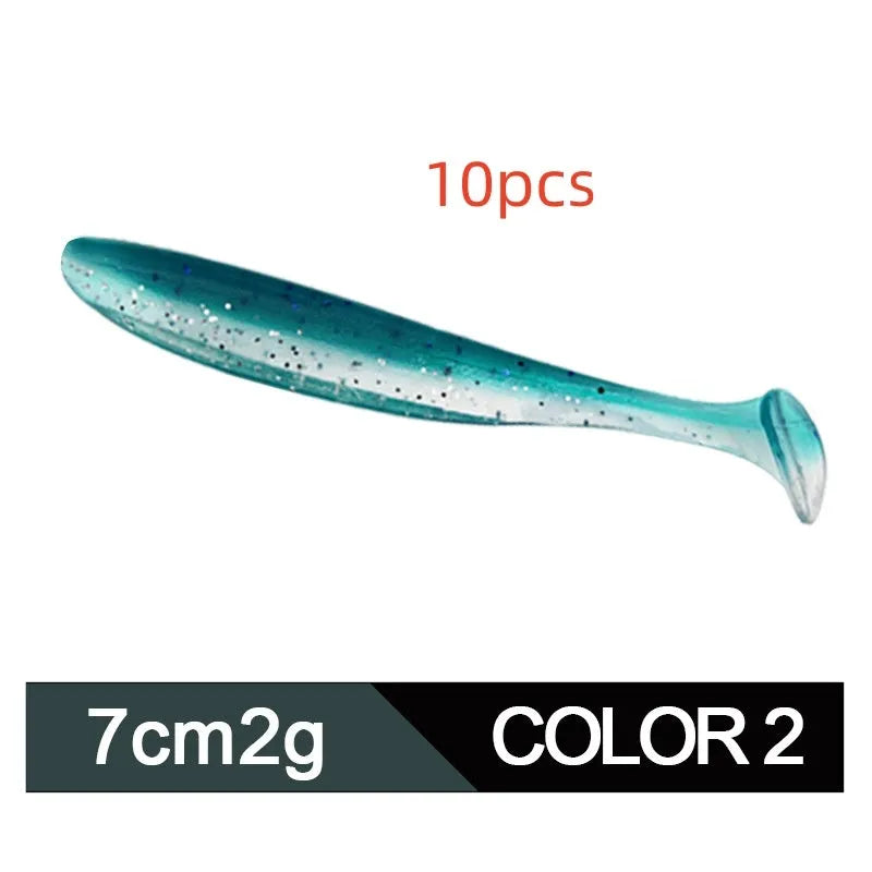 Soft plastic T-tail fishing lure in two-tone mandarin fish pattern, 7cm long.