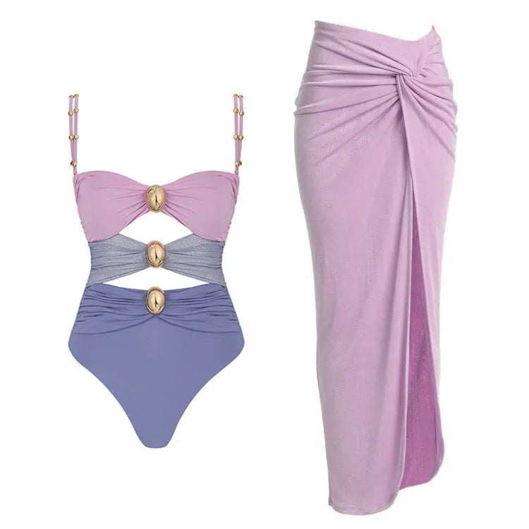 Women's one-piece swimsuit with skirt and gold buttons in solid colour options