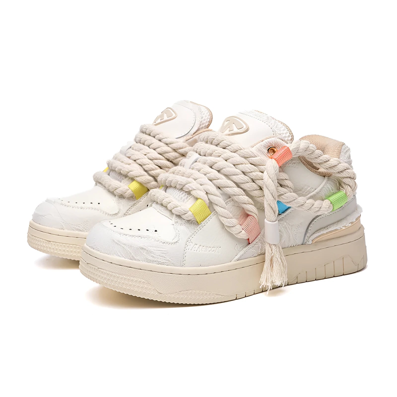 Creamy white retro low-top skate shoes with lace-up front and decorative stitching on a rubber sole.
