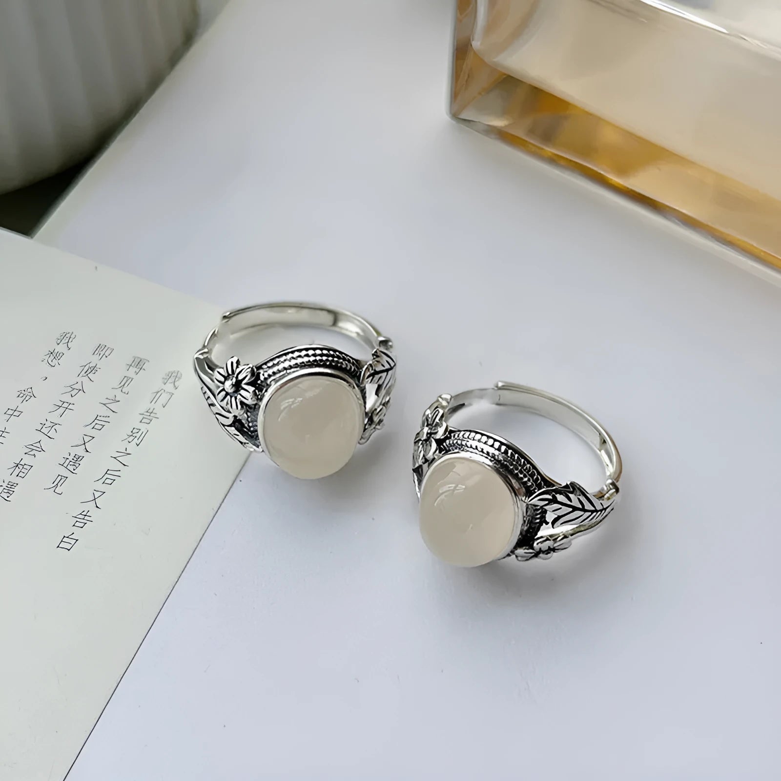 Adjustable copper vintage ring with white chalcedony stone and U-shaped band.