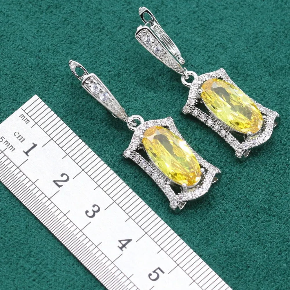 Olive and yellow anti-allergy alloy zircon jewellery set showing necklace, earrings, ring, and bracelet on a display.