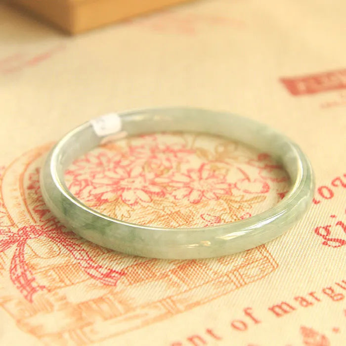 Green jade geometric bracelet with 10mm beads showing traditional Chinese style jewellery