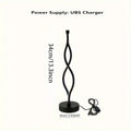 Black aluminium desk lamp with a dimming button and touch controls for blue and pink light