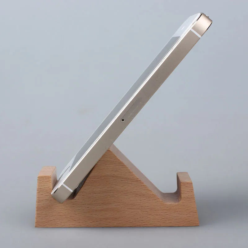 Beech wood mobile phone holder stand with coin slot and decorative carving.