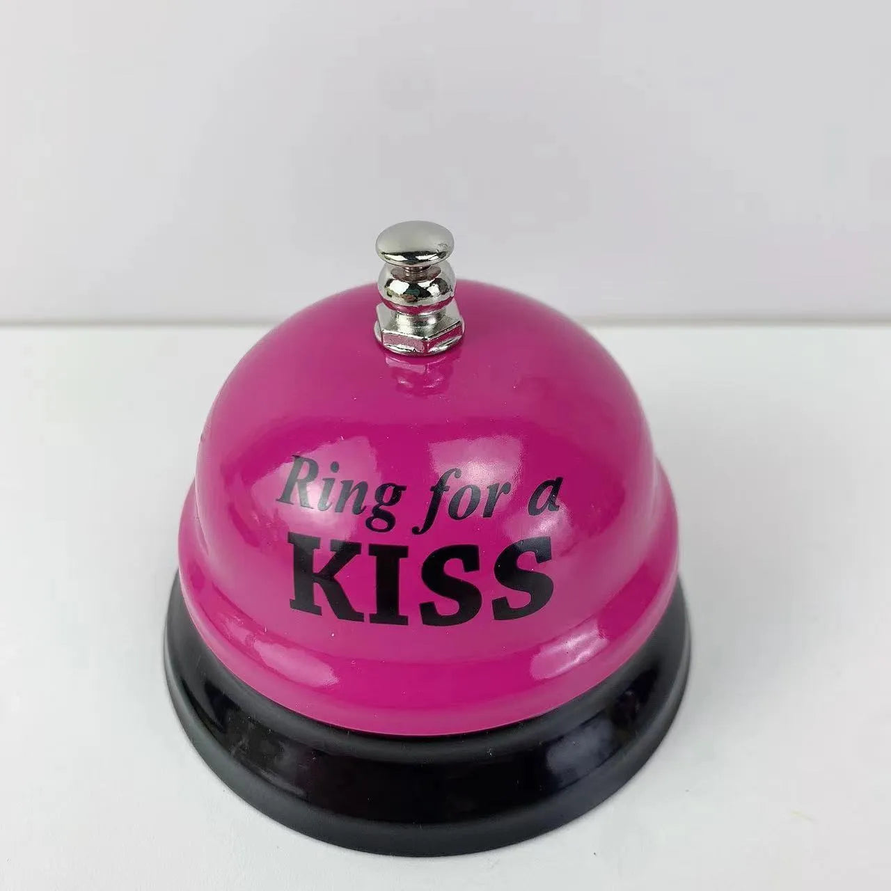 A multi-colour iron hand bell for games, classrooms, or restaurant service.