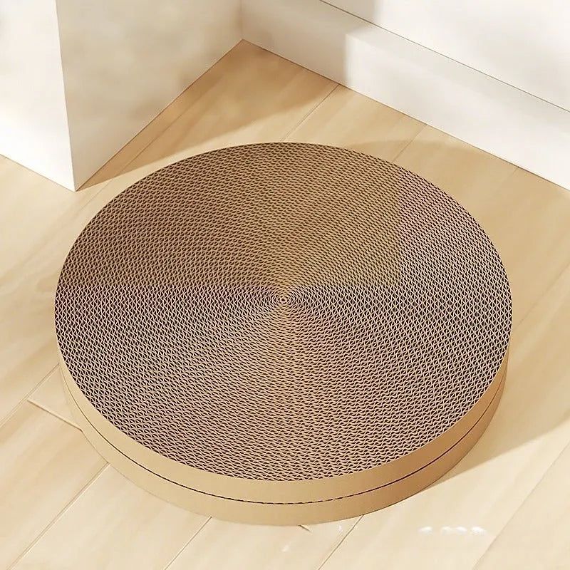 Green and white round cat scratching board with replaceable corrugated cardboard panels.