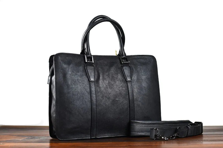 Men's brown leather horizontal business handbag with zip opening showing 14-inch size