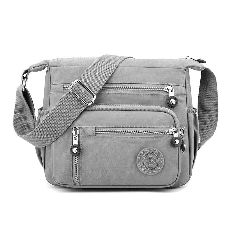 Nylon messenger shoulder bag in square vertical design with single strap and lining