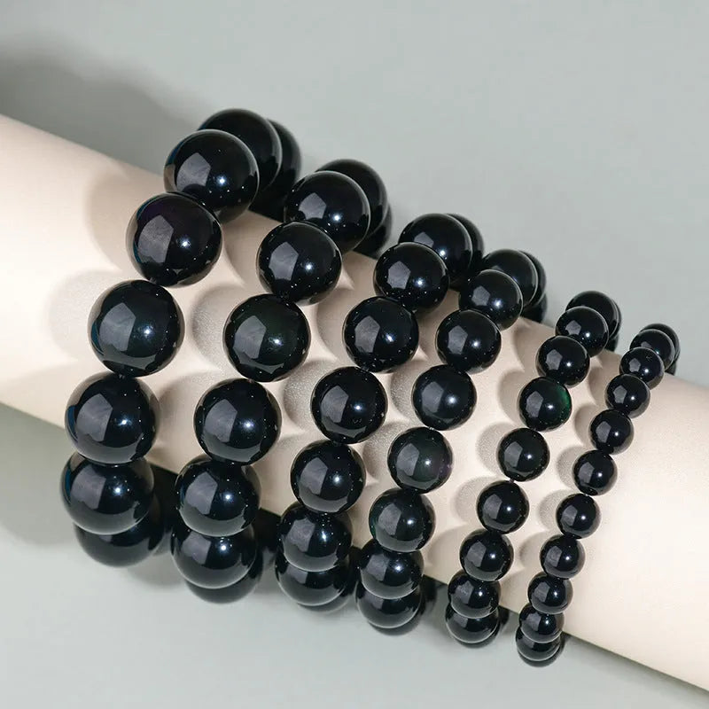 Hand-woven ethnic style unisex obsidian bracelet with round crystal beads.