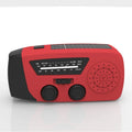 Red rechargeable handheld torch and radio unit with wrist strap and USB charging port.