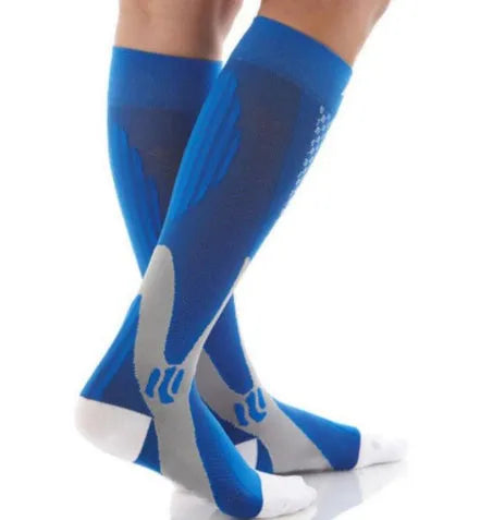 Graduated compression socks for men and women in black, shown laid flat.