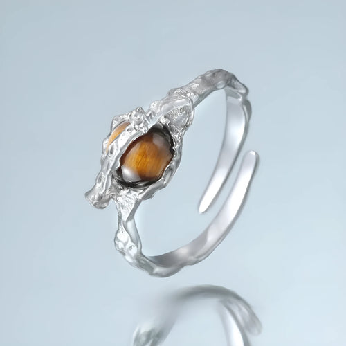 Adjustable opening Saturn ring in white gold colour tone on silver material
