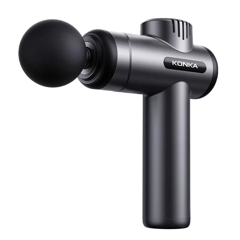 Konka professional electric mini massage gun in grey colour with multiple massage head attachments on a table.