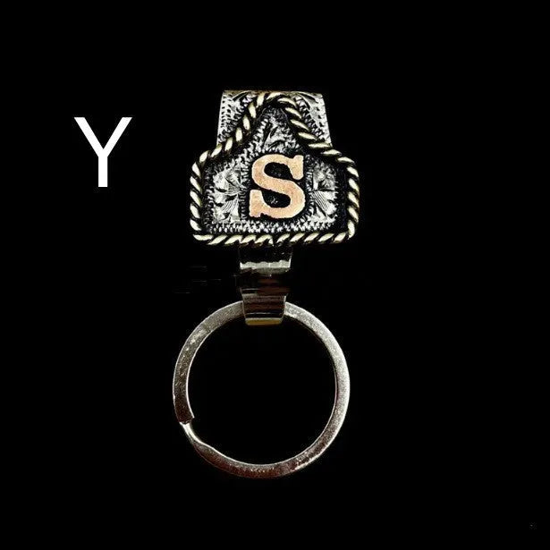 Handmade stainless steel cow tag belt key holder with engraved number plate on a split ring.