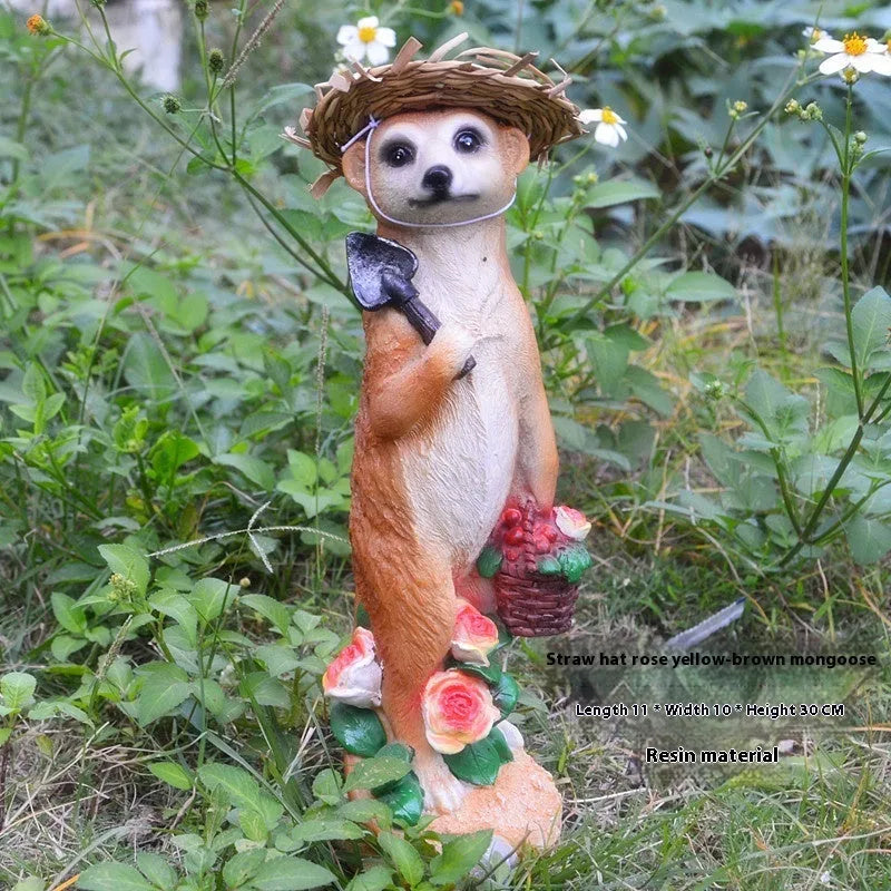 Resin mongoose garden ornament with straw hat and garden tool accessory