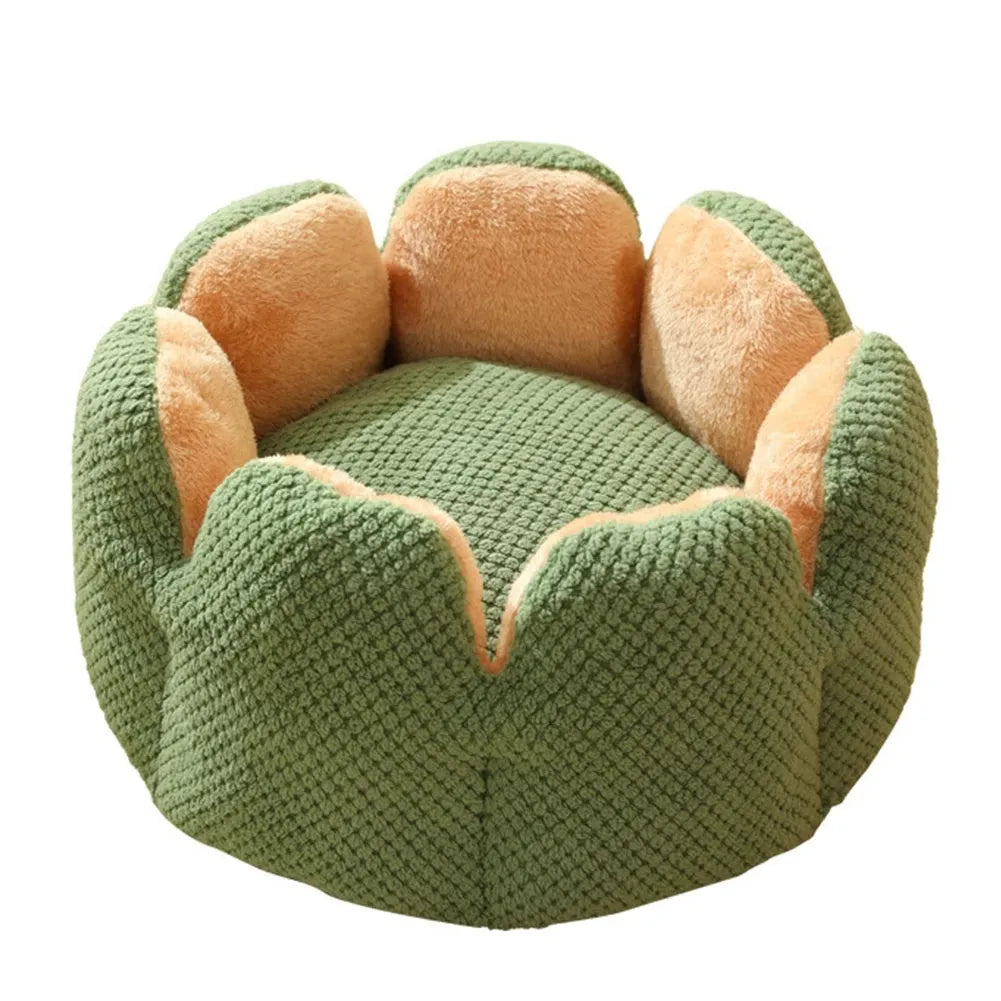 Green cactus petal shape plush kennel bed for cats and small dogs on a hardwood floor.