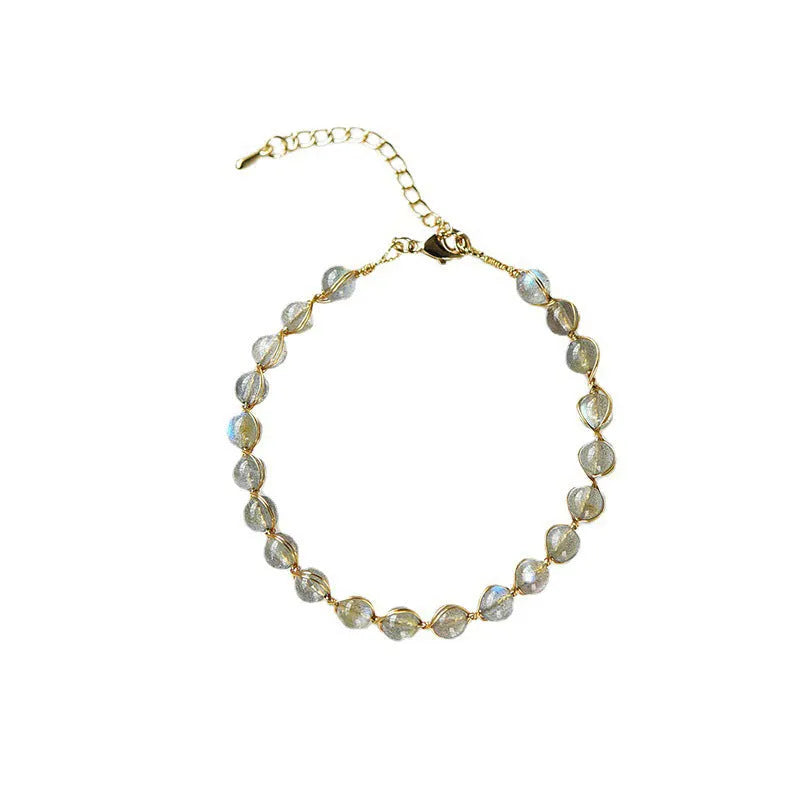 Women's blue moonstone bracelet with 6mm crystal and 14K gold-plated gilded metal band.