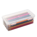 Transparent plastic stationery storage box containing pencils and colour crayons