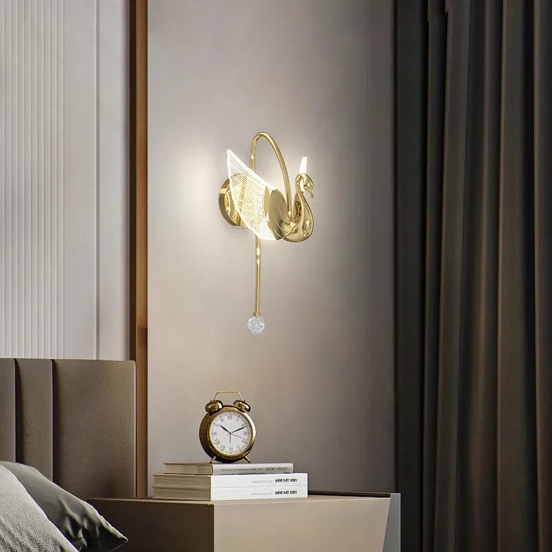 Gold modern swan-shaped wall-mounted bedside lamp with acrylic shade and dimmable LED light.