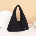 Nylon underarm bag with heart shape design in four colour options showing large capacity interior