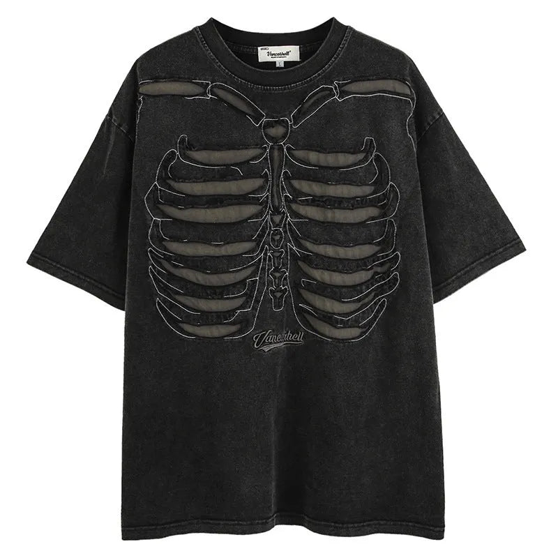 Man wearing a black loose-fit cotton T-shirt with a skull and letter graphic print on the chest.